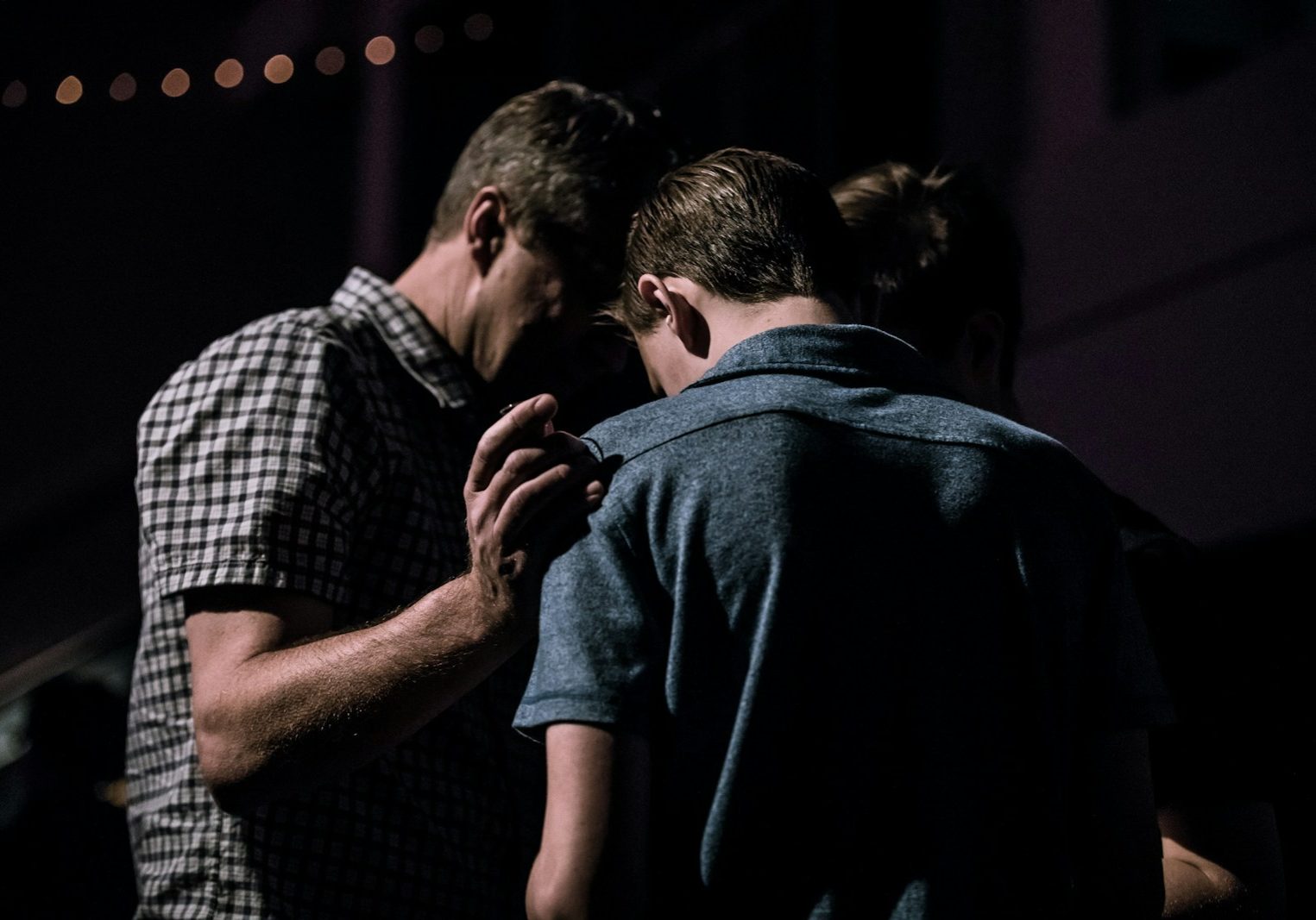 men touching each other's foreheads
